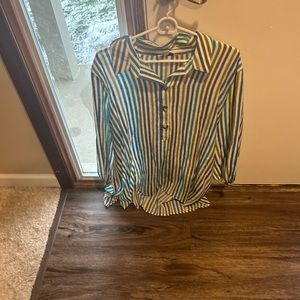 It is a women’s shirt Kim Roger’s